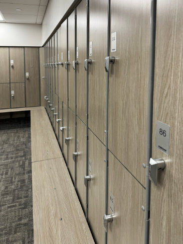 Italian Center of Stamford Mens and Womens Locker Room Installs FOREMAN Lockers in design Signature Phenolic with integrated bench wood grain pattern
